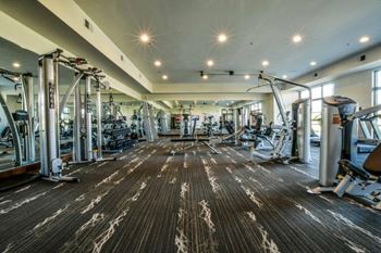 24-Hour Fitness Center with A View Of The Pool and Lake